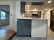 Well-lit kitchen with stainless steel appliances and peninsula counter looking into dining space at 3615 Kingsbury Dr, Holiday, FL 34691