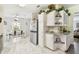 Bright kitchen features stainless steel appliances, modern counters, and dining area at 37510 New Horizons Blvd, Zephyrhills, FL 33541