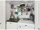 Laundry room with a Maytag washer and dryer, and shelving units for storage at 37510 New Horizons Blvd, Zephyrhills, FL 33541