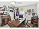 Cozy home office with a wooden desk, ceiling fan, and lots of baseball memorabilia at 37510 New Horizons Blvd, Zephyrhills, FL 33541