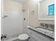Bathroom featuring tile shower, granite countertop, modern faucet, and tile flooring at 4151 55Th N Way # 1056, Kenneth City, FL 33709