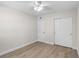 Neutral bedroom with wood floors, ceiling fan, and closet space at 4151 55Th N Way # 1056, Kenneth City, FL 33709