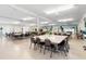 Spacious common room for residents to gather, complete with tables and chairs at 4151 55Th N Way # 1056, Kenneth City, FL 33709