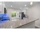 Bright kitchen with stainless appliances and granite counters at 4151 55Th N Way # 1056, Kenneth City, FL 33709