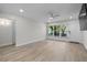 Bright living room with large windows and sleek floors at 4151 55Th N Way # 1056, Kenneth City, FL 33709