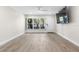 Bright living room with large windows and sleek floors at 4151 55Th N Way # 1056, Kenneth City, FL 33709