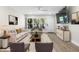 The living room is virtually staged with furniture, rug, and decor at 4151 55Th N Way # 1056, Kenneth City, FL 33709