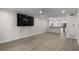 Spacious living room featuring sleek flooring, recessed lighting, and a ceiling fan at 4151 55Th N Way # 1056, Kenneth City, FL 33709