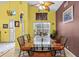 Bright dining room featuring a glass table, unique decor, and natural light at 4208 Edgewood Dr, Holiday, FL 34691