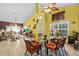Open-concept living and dining area with tile floors and lots of natural light at 4208 Edgewood Dr, Holiday, FL 34691