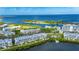 An aerial view of waterfront condos with boating access to the bay at 459 Bahia Beach Blvd, Ruskin, FL 33570