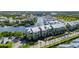 Aerial view showcasing waterfront condominiums with docks, boat slips, and canal access at 459 Bahia Beach Blvd, Ruskin, FL 33570