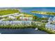 Aerial image highlighting waterfront condo complex with private docks and convenient access to open water at 459 Bahia Beach Blvd, Ruskin, FL 33570