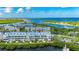 Drone shot of waterfront condos offering incredible views, dock access, and a relaxed waterfront lifestyle at 459 Bahia Beach Blvd, Ruskin, FL 33570