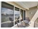 Waterfront balcony featuring canal views and outdoor seating with coastal décor at 459 Bahia Beach Blvd, Ruskin, FL 33570