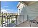 Balcony view of street, other condos, and palm trees; complete with outdoor seating at 459 Bahia Beach Blvd, Ruskin, FL 33570