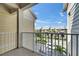 Balcony view of street, other condos, and palm trees at 459 Bahia Beach Blvd, Ruskin, FL 33570