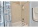Cozy bathroom featuring a shower and tub combo with seashell-themed curtains and tiled walls at 459 Bahia Beach Blvd, Ruskin, FL 33570