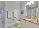 Bright bathroom featuring granite countertops, white cabinets, and nautical themed decor at 459 Bahia Beach Blvd, Ruskin, FL 33570