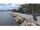 Beach area with colorful chairs by the waterfront property at 459 Bahia Beach Blvd, Ruskin, FL 33570