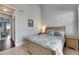 Bedroom with cozy bed, coastal-themed bedding, and a view of the balcony at 459 Bahia Beach Blvd, Ruskin, FL 33570