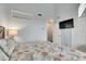 Bedroom featuring vaulted ceilings, a TV, and a closet for ample storage at 459 Bahia Beach Blvd, Ruskin, FL 33570