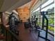 Bright fitness center with many machines and floor to ceiling windows at 459 Bahia Beach Blvd, Ruskin, FL 33570