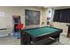Entertaining game room with a pool table and vintage arcade games, ideal for Gathering fun and recreation at 459 Bahia Beach Blvd, Ruskin, FL 33570