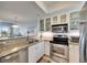 Kitchen with granite countertops, stainless steel appliances, and white cabinets at 459 Bahia Beach Blvd, Ruskin, FL 33570