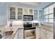 Kitchen with granite countertops, stainless steel appliances, and white cabinets at 459 Bahia Beach Blvd, Ruskin, FL 33570