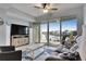 Cozy living room with a balcony offering waterfront views at 459 Bahia Beach Blvd, Ruskin, FL 33570
