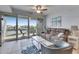 Cozy living room features a canal view balcony with comfortable seating and neutral decor at 459 Bahia Beach Blvd, Ruskin, FL 33570