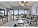 Spacious living area with waterfront views from the private balcony at 459 Bahia Beach Blvd, Ruskin, FL 33570