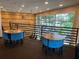 Well-lit lounge area with tables and seating by a big window at 459 Bahia Beach Blvd, Ruskin, FL 33570