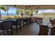 Spacious outdoor patio with comfortable seating and bar area, perfect for social gatherings and relaxation at 459 Bahia Beach Blvd, Ruskin, FL 33570