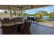 Spacious community patio with seating and a beautiful view of the water at 459 Bahia Beach Blvd, Ruskin, FL 33570