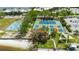 Aerial view of pickleball courts with lush landscaping and nearby amenities at 459 Bahia Beach Blvd, Ruskin, FL 33570