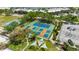 Pickleball and basketball courts surrounded by lush greenery, offering recreational opportunities at 459 Bahia Beach Blvd, Ruskin, FL 33570