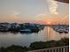 Picturesque waterfront view of luxury homes and boats docked in the marina at sunset, a stunning coastal lifestyle at 459 Bahia Beach Blvd, Ruskin, FL 33570