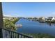 Beautiful waterfront view featuring a serene channel, docks, and coastal residences under a clear blue sky at 459 Bahia Beach Blvd, Ruskin, FL 33570