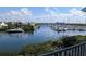 Expansive waterfront view of boats docked along the channel and under a partly cloudy sky at 459 Bahia Beach Blvd, Ruskin, FL 33570