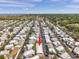 Drone shot of community homes with a red arrow highlighting a property at 4851 W Gandy Blvd # B3 L8, Tampa, FL 33611
