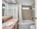 Bathroom featuring sink, shower, and marble countertop vanity, offering a clean and bright space at 4851 W Gandy Blvd # B3 L8, Tampa, FL 33611