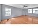 Spacious bedroom with hardwood floors, natural light, and a ceiling fan, promoting relaxation at 4851 W Gandy Blvd # B3 L8, Tampa, FL 33611