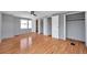 Bedroom highlighting hardwood floors, closet, and storage, offering a peaceful haven at 4851 W Gandy Blvd # B3 L8, Tampa, FL 33611