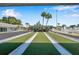 Bocce ball court surrounded by tropical landscaping, creating a serene atmosphere for outdoor recreation at 4851 W Gandy Blvd # B3 L8, Tampa, FL 33611