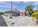 Charming home with a carport and shed featuring durable and stylish brick paver driveway at 4851 W Gandy Blvd # B3 L8, Tampa, FL 33611