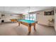 Spacious game room features two billiard tables, dart board, and comfortable seating at 4851 W Gandy Blvd # B3 L8, Tampa, FL 33611