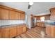 Well-lit kitchen featuring stainless steel appliances and wood flooring with neutral paint at 4851 W Gandy Blvd # B3 L8, Tampa, FL 33611