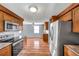 Modern kitchen with stainless steel appliances and an adjacent dining or living area at 4851 W Gandy Blvd # B3 L8, Tampa, FL 33611